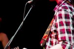 That side-on from behind look! Chequered Shirts are in...this band...all over the place!